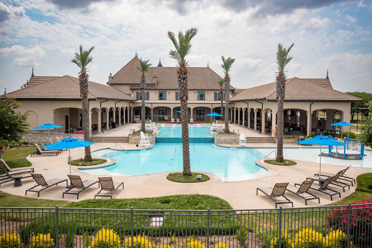 palm trees and plantings near pool at HOA