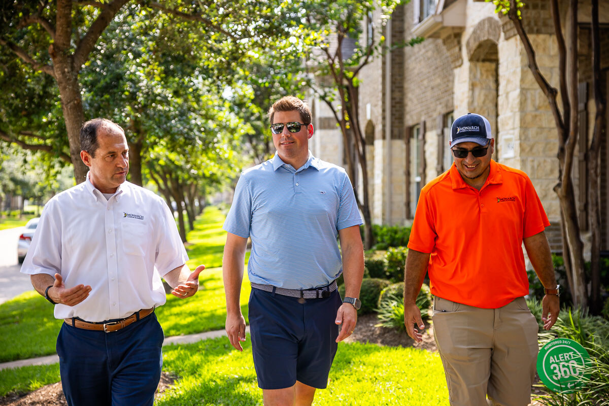 landscape maintenance team walks through property