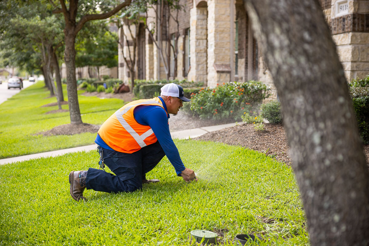 crew adjusts irrigation