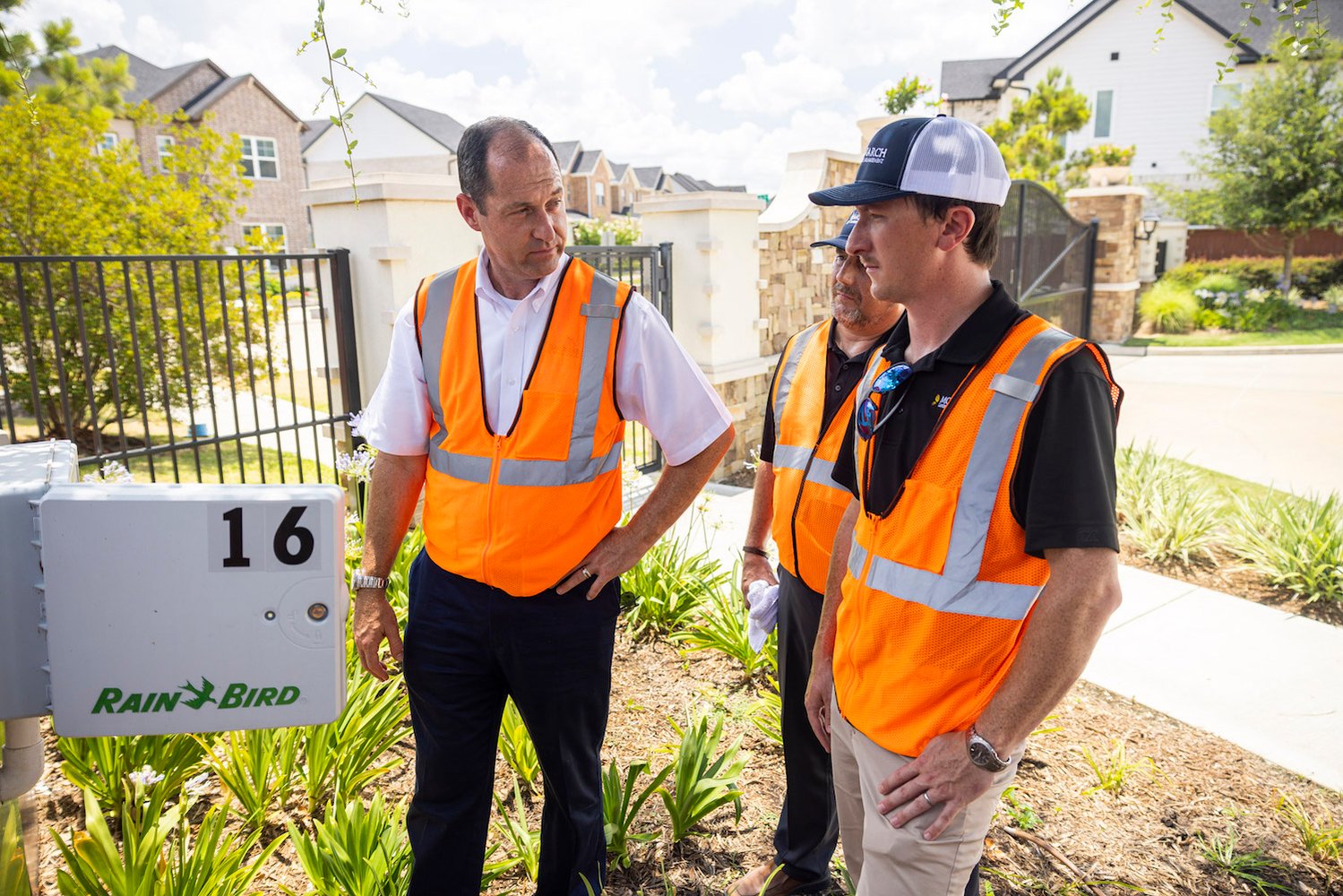 irrigation team inspects controller