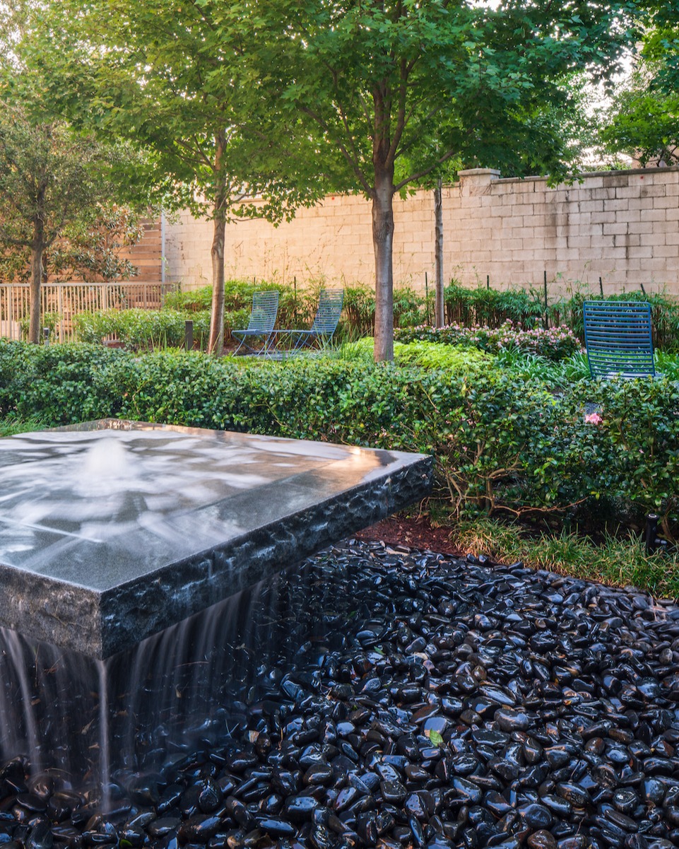 water-fountain-rocks-shrubs