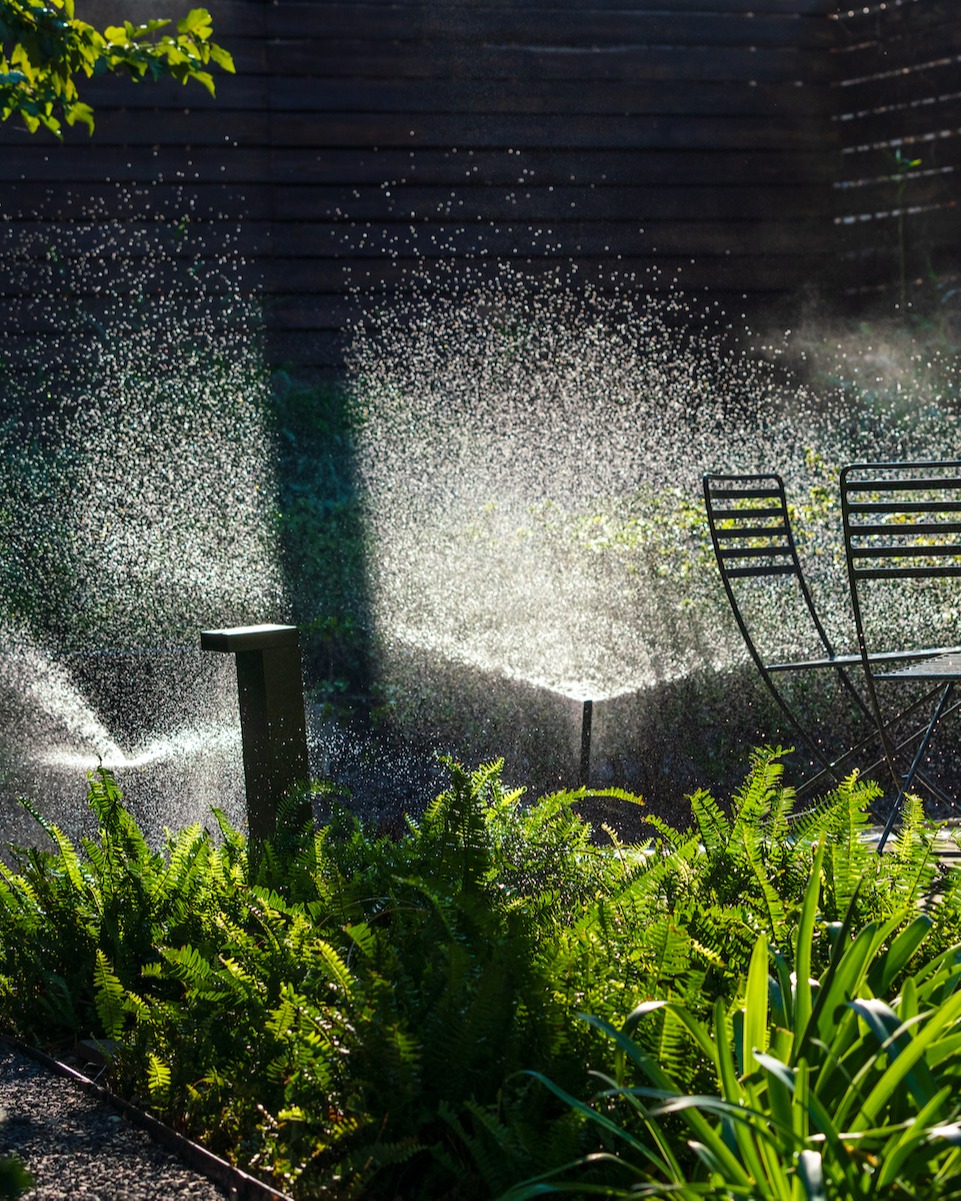 sprinkler spraying water on a landscape